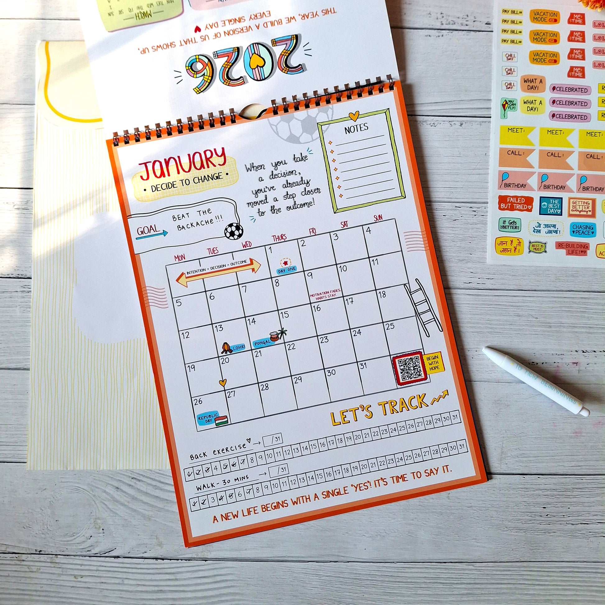 Calendar with January layout on a wooden surface with decorative items